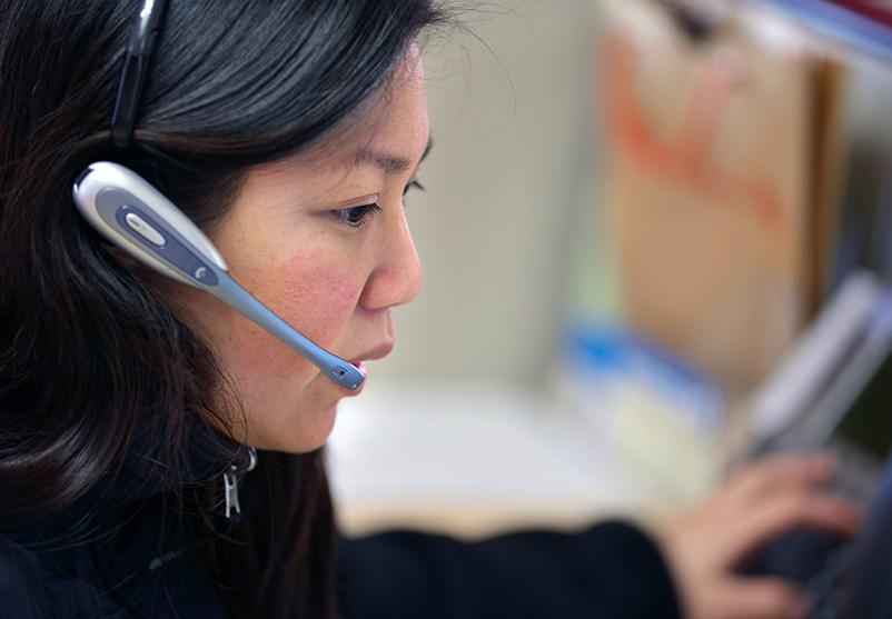 A staff member wearing a headset