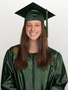 Young woman smiling in a green graduation cap and gown.